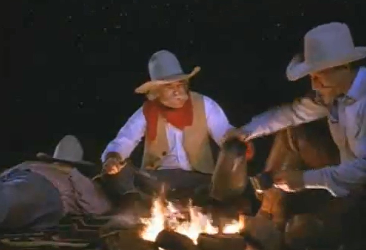 Cowboys around a campfire recite a poem about keeping Texas clean.