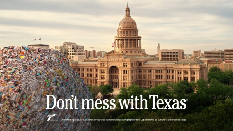 A ball of litter in front of the Texas state capital building.